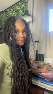 black girl artist at desk